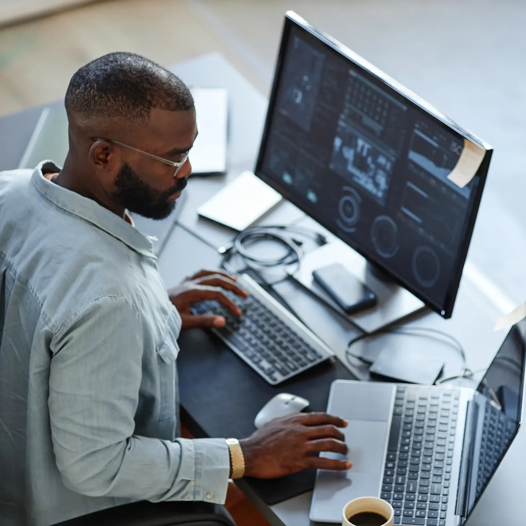 Man-looking-at-data-on-monitor
