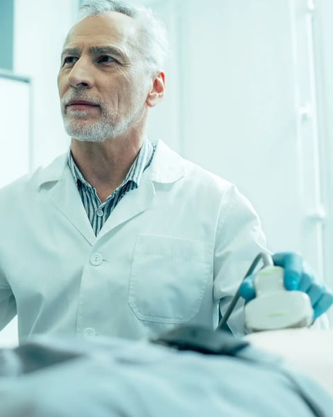 male doctor scanning patient