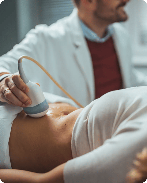 man scanning woman stomach