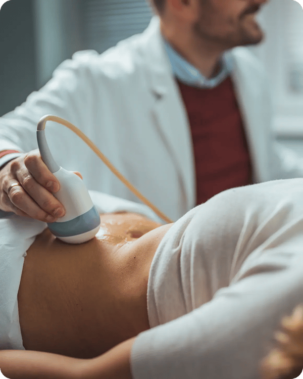 man scanning woman stomach