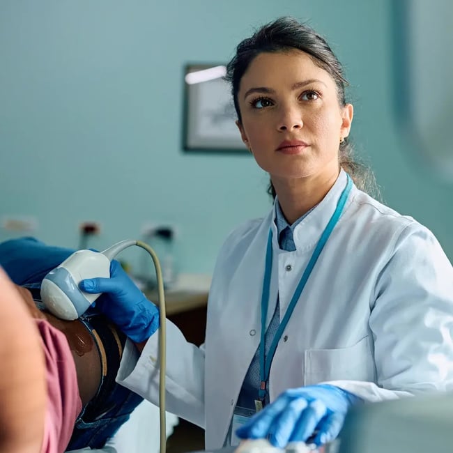 woman scanning patient looking up